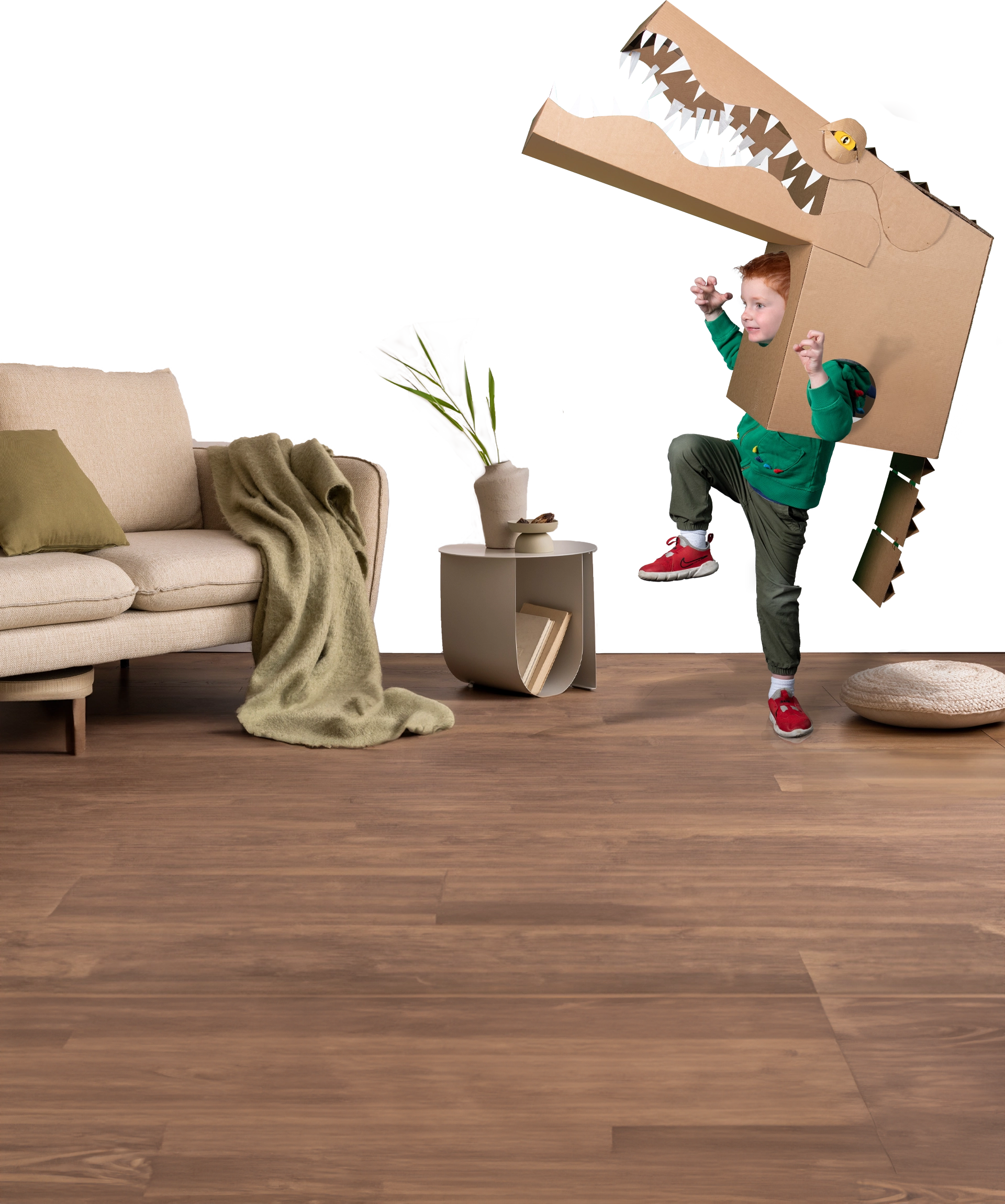 Child in living room wearing a corrugate alligator costume