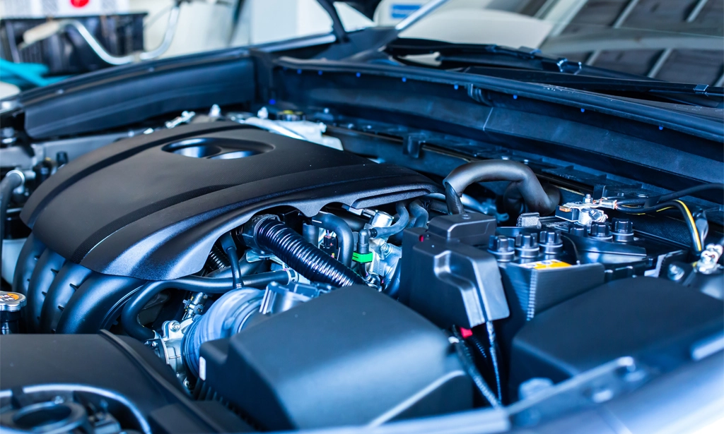 Car engine under the hood of a car