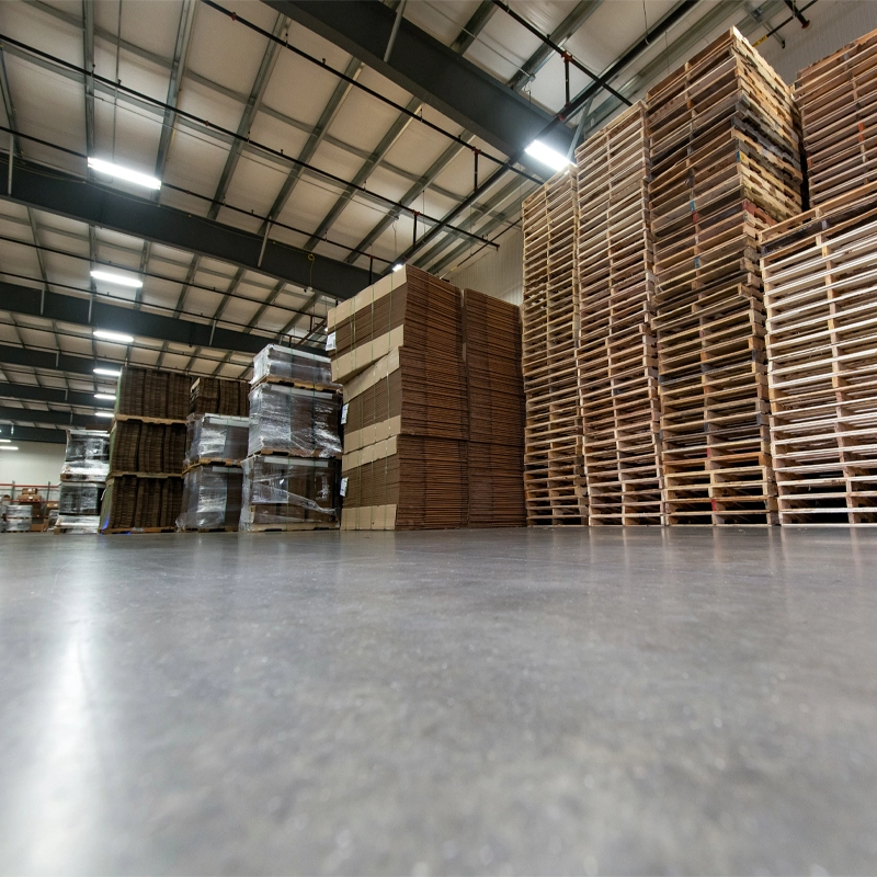 Landaal factory floor with stacks of corrugate and pallets