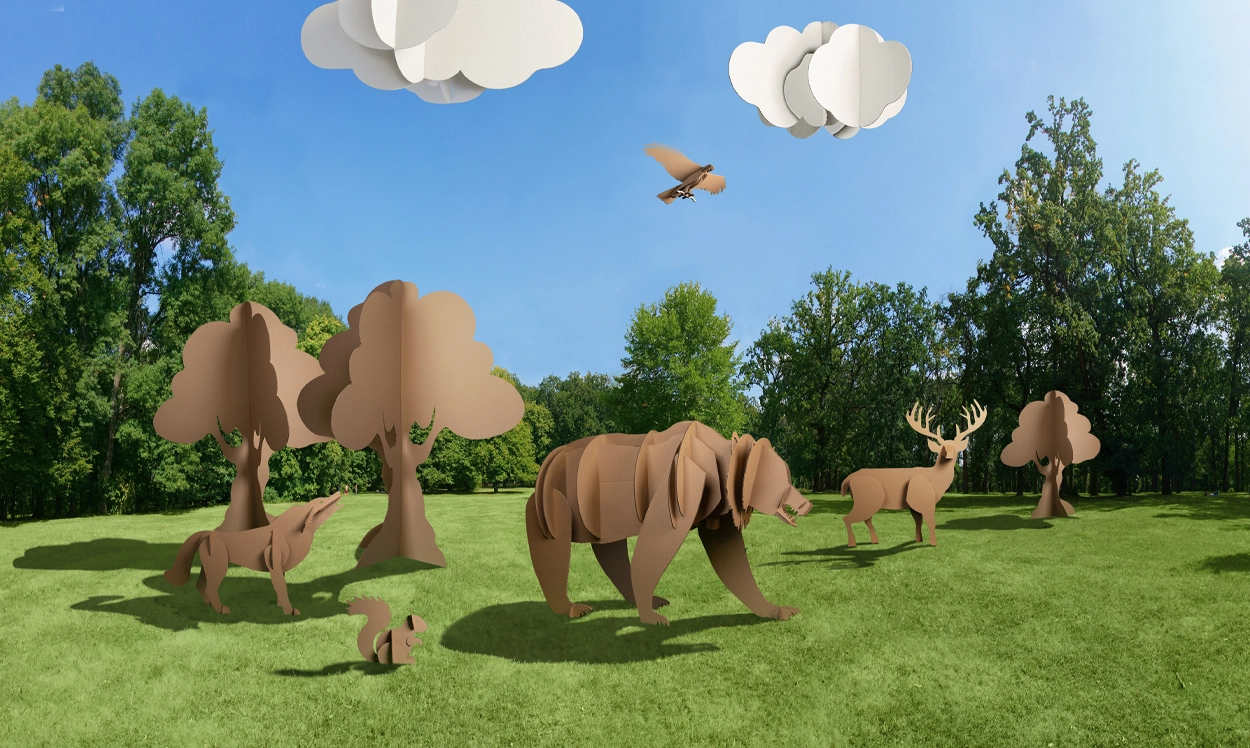 Nature scene of corrugate animals, clouds and trees. Sustainable packaging solutions